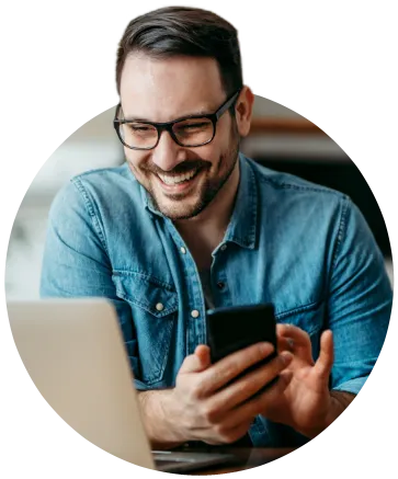 man with laptop and phone